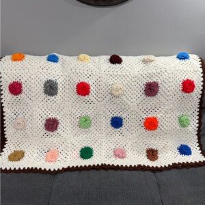 Colorful Crochet Granny Afghan with Floral Accents